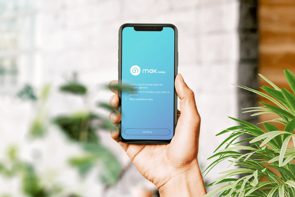 a mobile phone showing a mak.today app on the screen